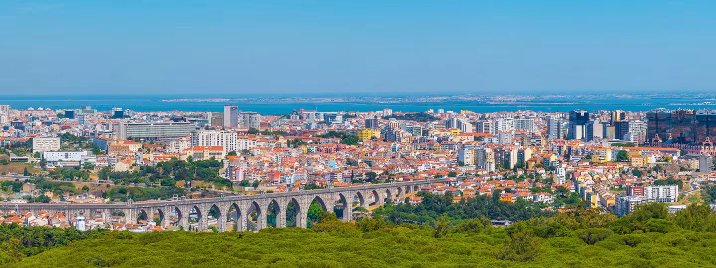 Aerial view of Lisbon dominated by an ancient aqueduct, Portugal