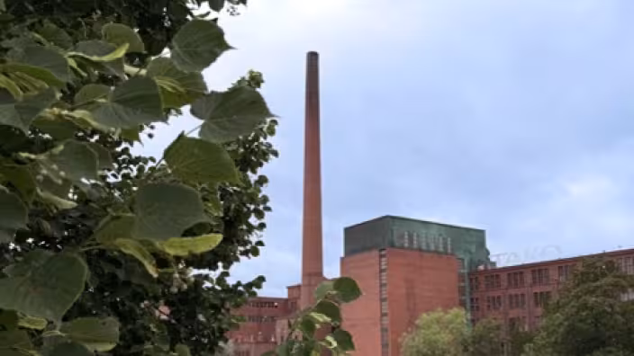 brick industrial building along along a dark river