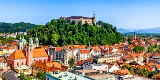 Old town and the medieval Ljubljana castle on top of a forest hill in Ljubljana, Slovenia