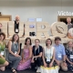 EFI staff posing for a group photo in front of the wooden sign IUFRO