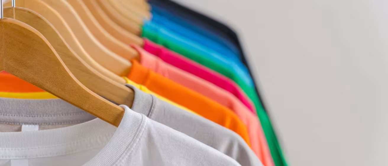 colourful t-shirts in hangers